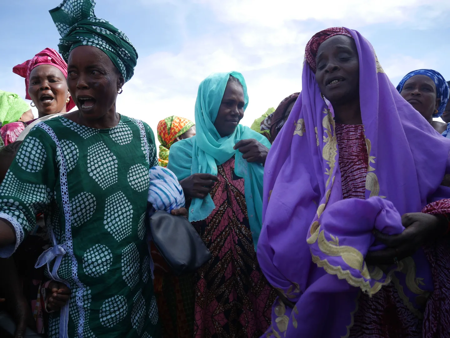 Women of a partner cooperative on the village square